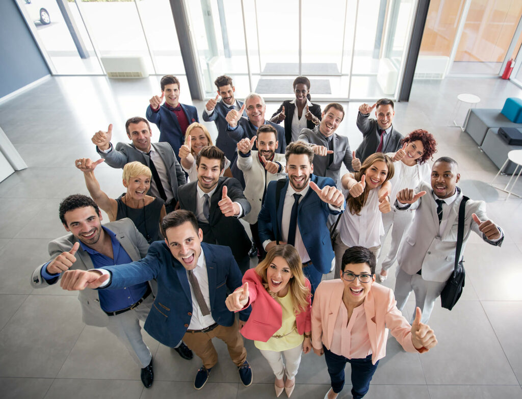 Smiling people with thumbs up