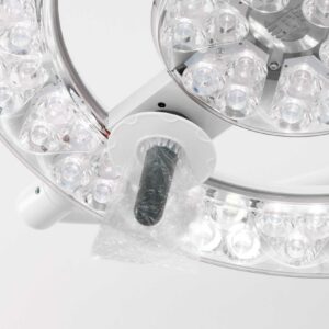 Q-Flow Fluent surgical lamp with disposable sterile light handle cover.